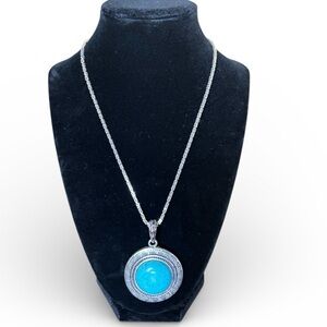 turquoise silver-toned pendant detailed with a Grecian "Meander" motif
